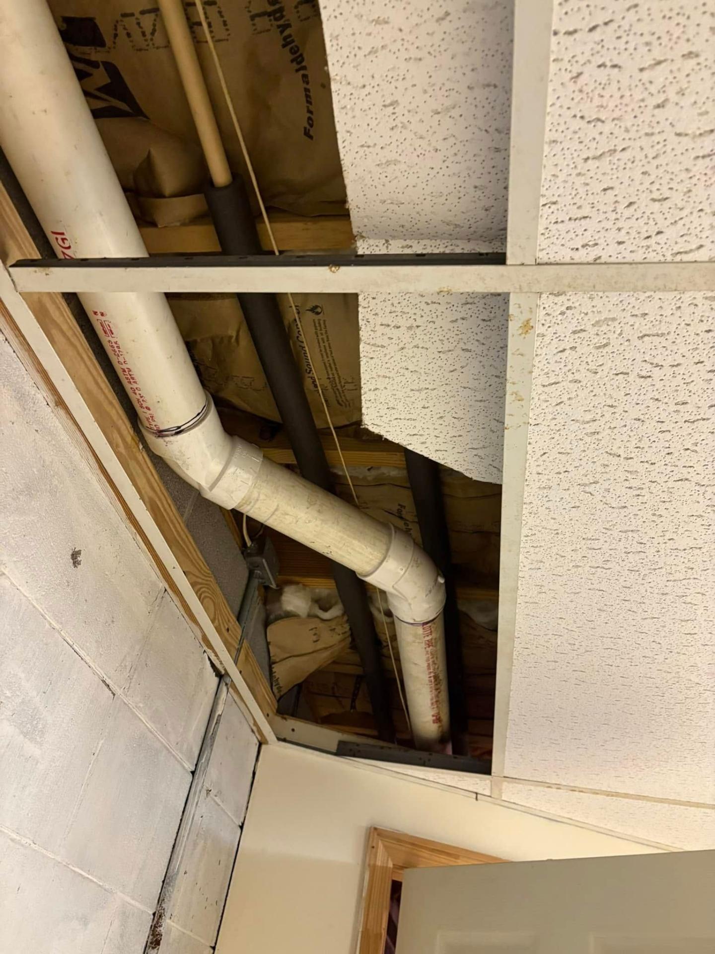 PVC pipe repiping work in ceiling by Waterman Plumbing