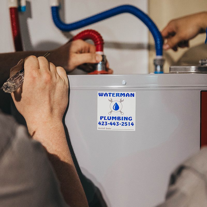 Waterman Plumbing technician installing a water heater in Cleveland, TN